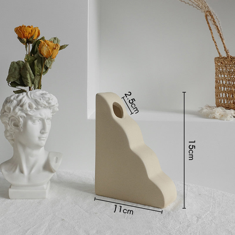 Decorative ceramic vase with floral arrangement 
