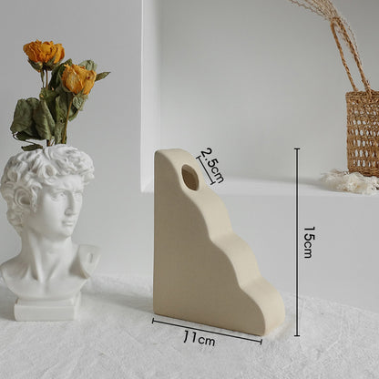 Decorative ceramic vase with floral arrangement 