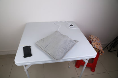 Rechargeable electric foot warmer in use