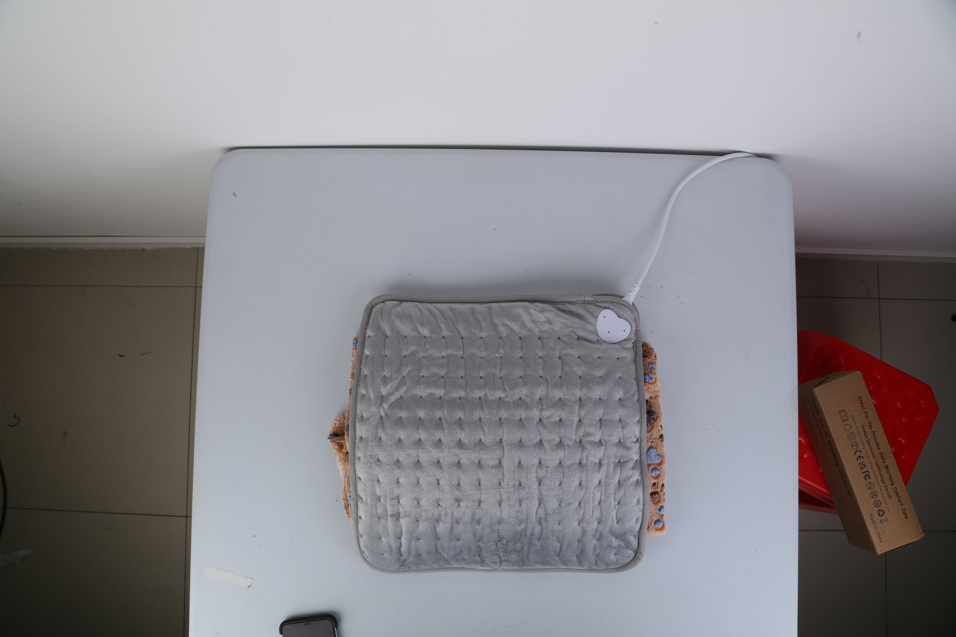 Soft heated foot warmer in gray color